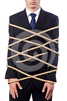 Businessman tied up with rope