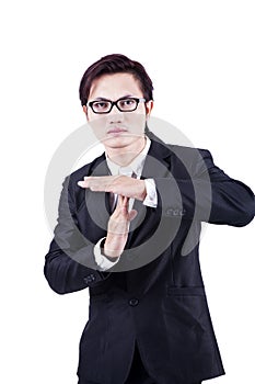 Businessman with time out hand gesture