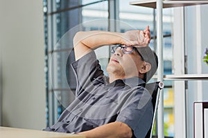 Businessman tired overworked he relaxing with closed eyes