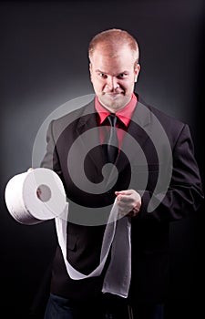 Businessman with toilette paper photo