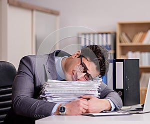 Businessman with too much paperwork