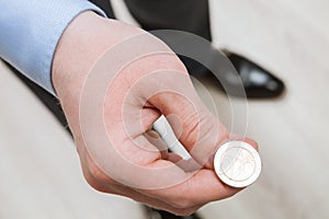 Businessman tossing a coin