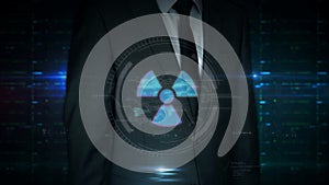 Businessman touch screen with nuclear energy symbol hologram