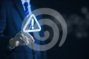 Businessman touch warning triangle and exclamation sign icon Warning of dangerous problems Server error. Virus. Maintenance