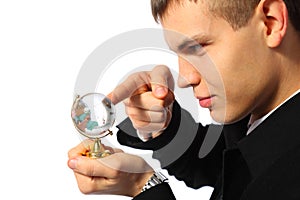 Businessman touches finger glass globe