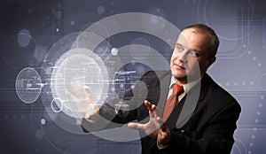 Businessman touching abstract high technology circular buttons