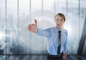 Businessman touching the air with windows