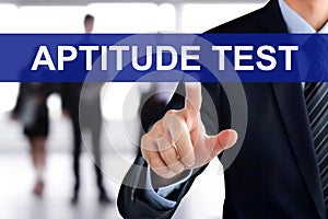 Businessman touching APTITUDE TEST tab on virtual screen