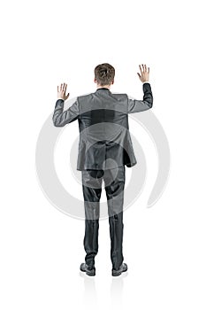 Businessman touching with both hands rear isolated