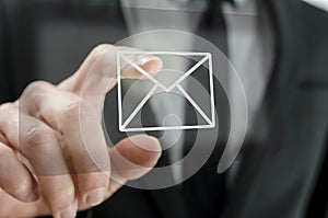 Businessman touching email icon