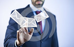 Businessman touching email icon on a virtual screen