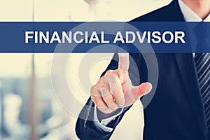 Businessman touching FINANCIAL ADVISOR sign on virtual scre