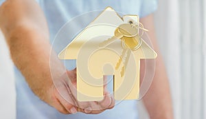 Businessman touching key with house keyring in his finger 3D rendering