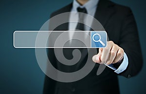 Businessman Touching Magnifier Icon In Search Box