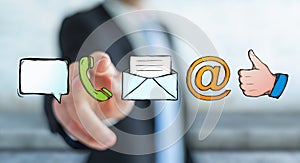 Businessman touching manuscript contact icon with his finger