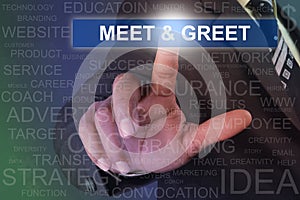 Businessman touching MEET & GREET button on virtual screen