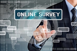 Businessman touching ONLINE SURVEY button on virtual screen