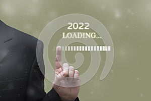 Businessman touching progress bar. Loading 2022 new year concept