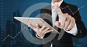 Businessman touching raising graph on screen. Business growth, investment and finance concept