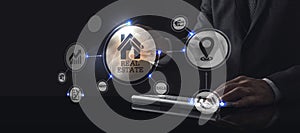 Businessman touching screen with about Real Estate icon