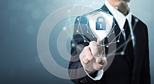 Businessman touching shield protect icon, Concept cyber security photo
