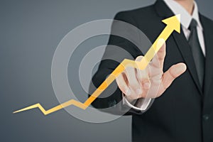 Businessman  Touching stock Graph Indicating Growth