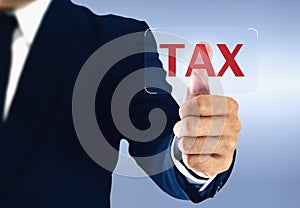 Businessman touching tax virtual button. Concept of taxes paid by individuals and corporations