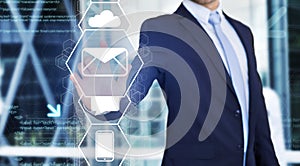 Businessman touching technology interface with business email icon