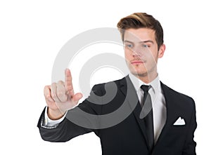 Businessman touching transparent screen