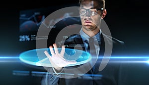 Businessman touching virtual chart projection