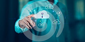 A businessman touching a virtual cloud with a key icon, symbolizing cybersecurity, cloud data protection, privacy encryption, and