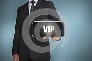 Businessman touching the word vip