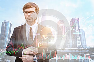 Businessman trader in suit on sunrise overlay with cityscape