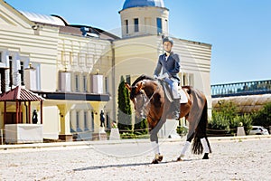 Businessman training before taking part in big annual horseracing festival