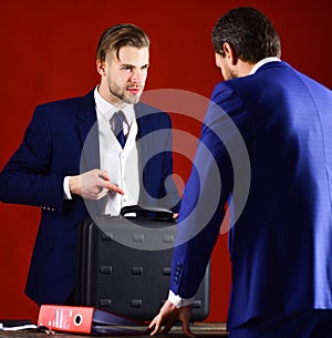 Businessman transfer deal, business black briefcase and folder with documents