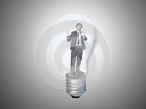 Businessman trapped in lightbulb