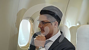 Businessman travel on a business trip by airplane