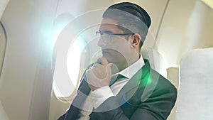 Businessman travel on a business trip by airplane