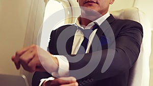 Businessman travel on a business trip by airplane