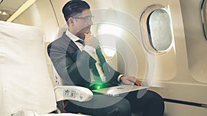 Businessman travel on a business trip by airplane