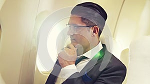 Businessman travel on a business trip by airplane