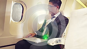 Businessman travel on a business trip by airplane