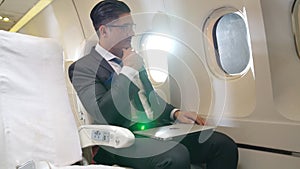 Businessman travel on a business trip by airplane