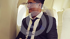 Businessman travel on a business trip by airplane