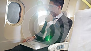 Businessman travel on a business trip by airplane