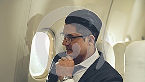 Businessman travel on a business trip by airplane