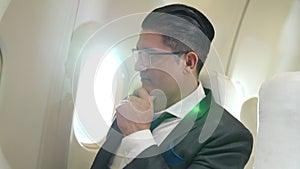 Businessman travel on a business trip by airplane