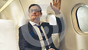 Businessman travel on a business trip by airplane