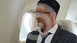 Businessman travel on a business trip by airplane