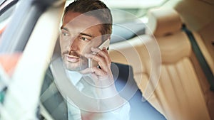 Businessman, travel and speaking with phone call in car for commute, conversation or communication. Man or employee on